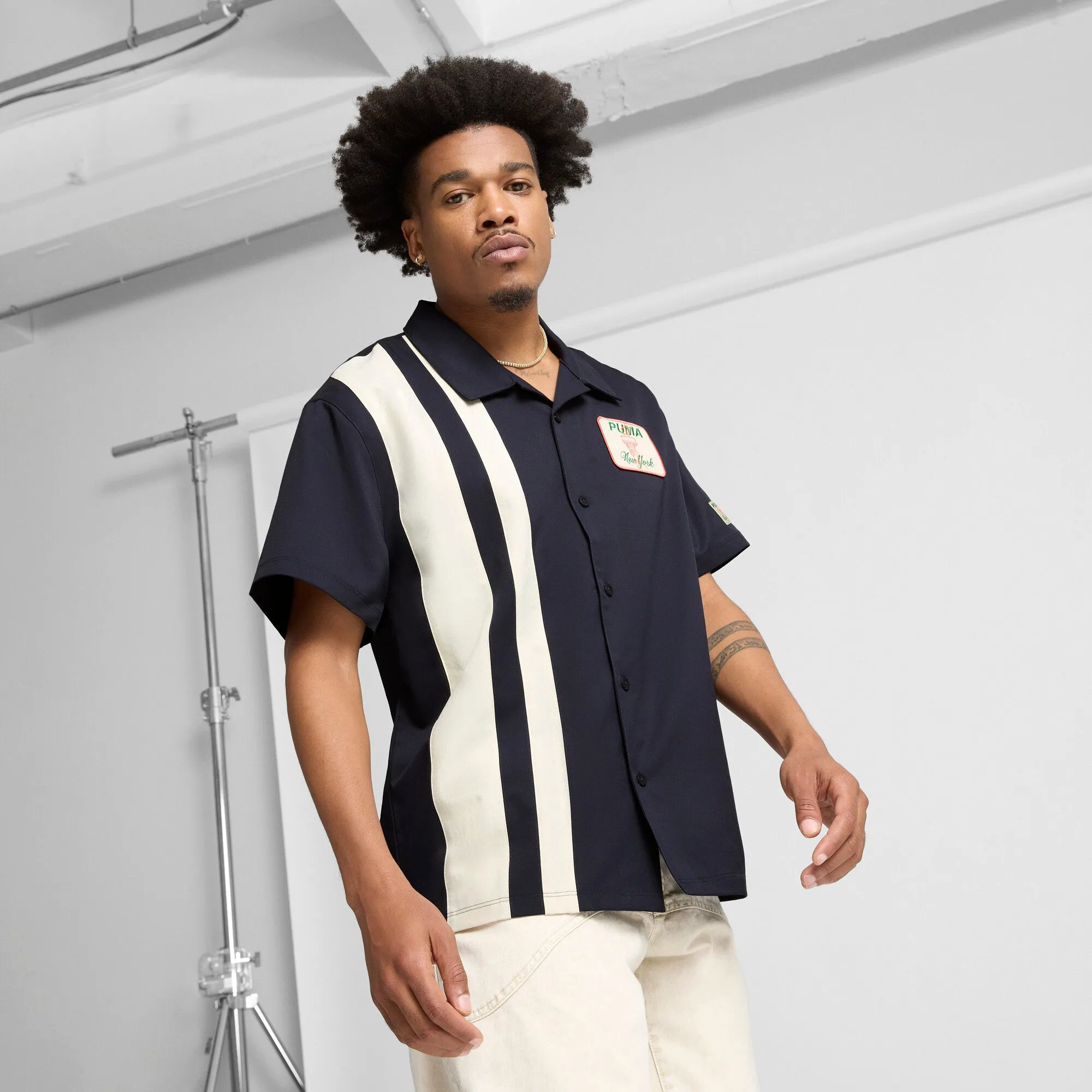 PUMA Men's Wardrobe Essentials Bright Lights NYC Flagship Relaxed Tee