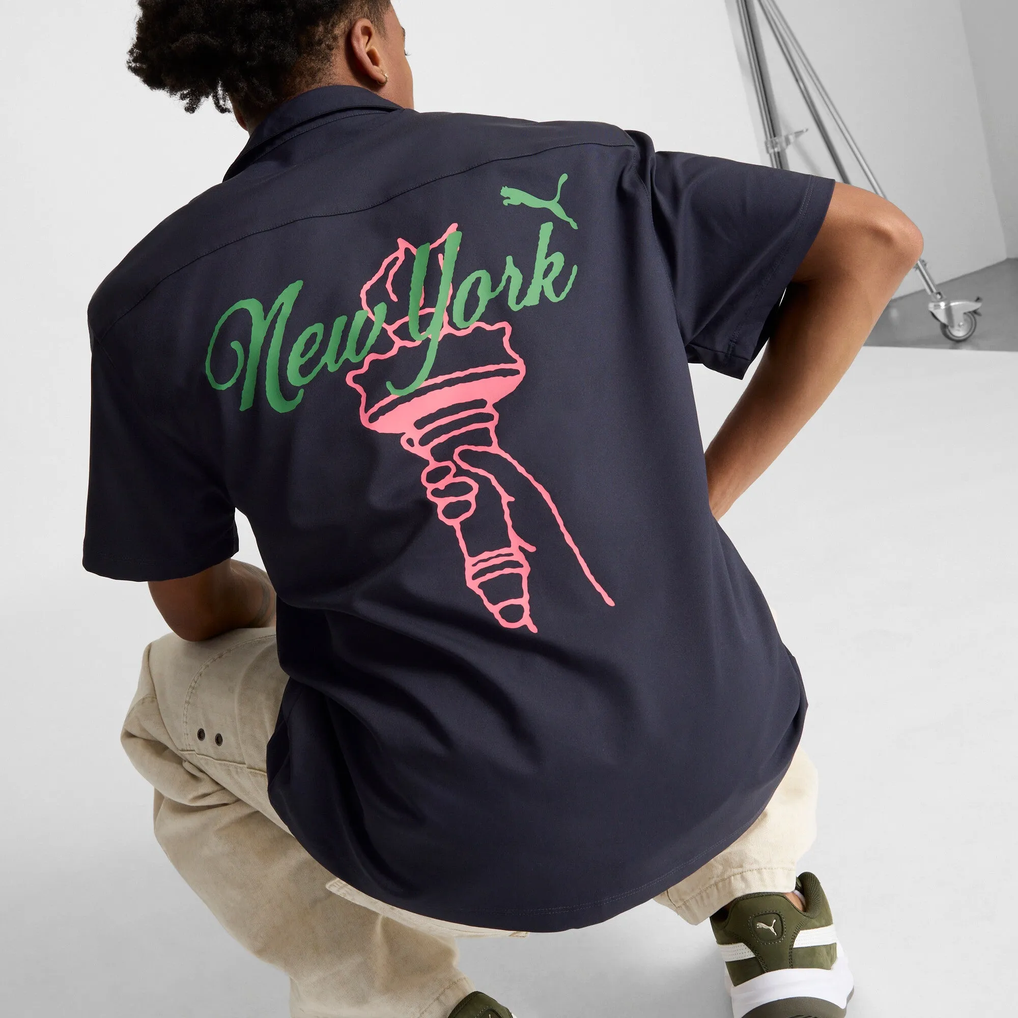 PUMA Men's Wardrobe Essentials Bright Lights NYC Flagship Relaxed Tee